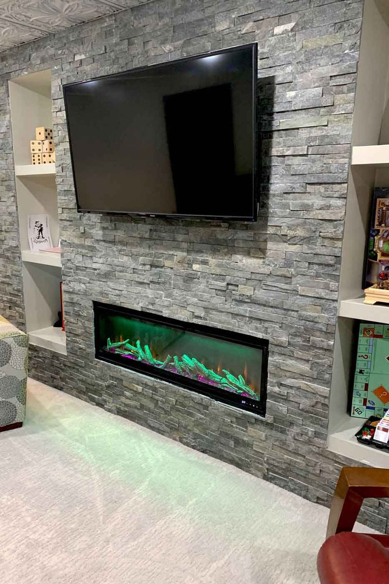 basement remodel with tv and fire place in Central Illinois by True Craft Remodelers