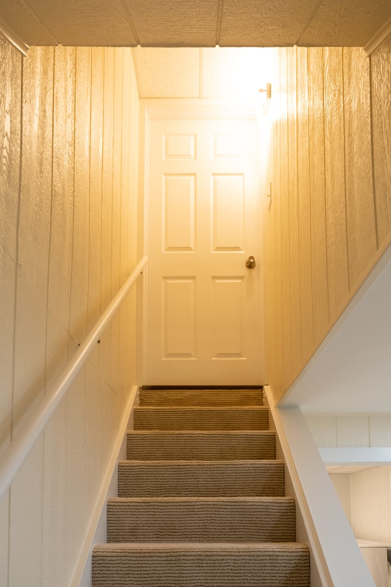 View of stairway & door leading from basement to first floor