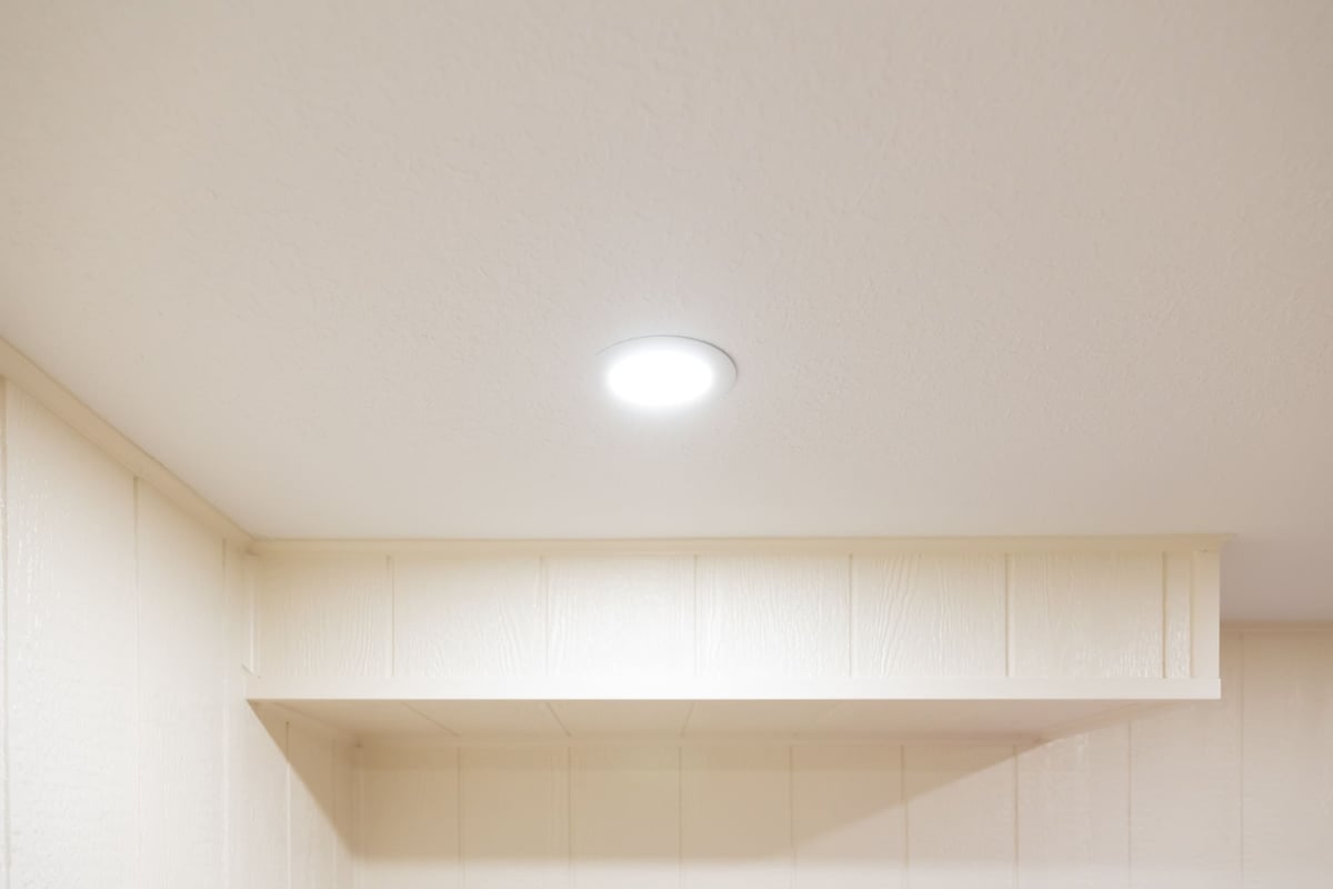 White ceiling with recessed lighting and walls in basement remodel