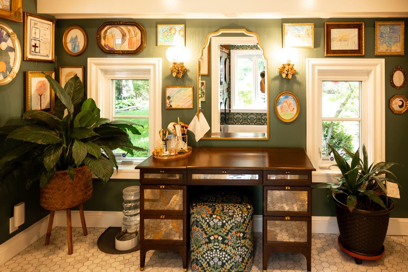 Vanity with drawers with large gold mirror and lights with seating