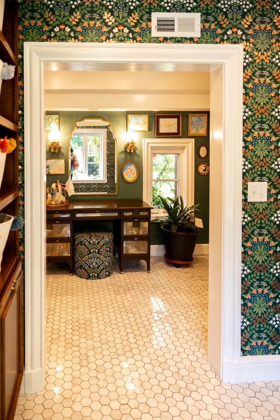 White Tiled Floors & Doorway Looking Into Bathroom With Green Walls and Wall Paper